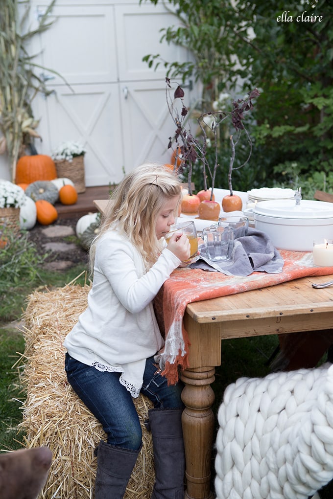 Cozy Fall Outdoor Table with hot wassail and caramel apples.