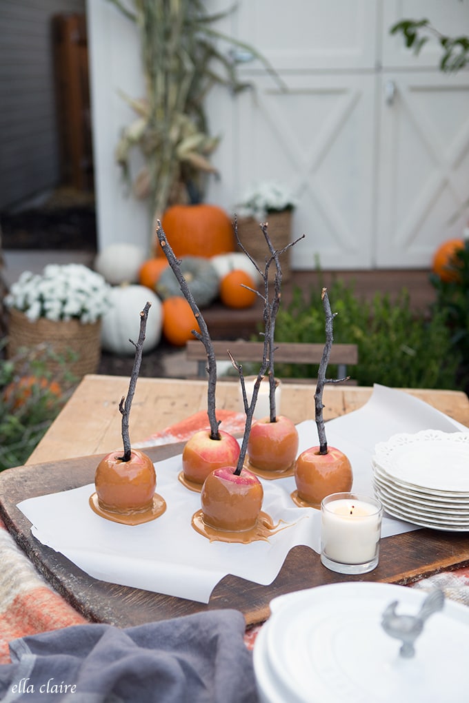 Cozy Fall Outdoor Table with hot wassail and caramel apples.
