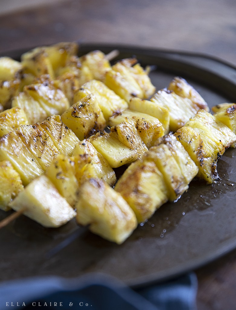 pineapple kabobs laid out on a tray