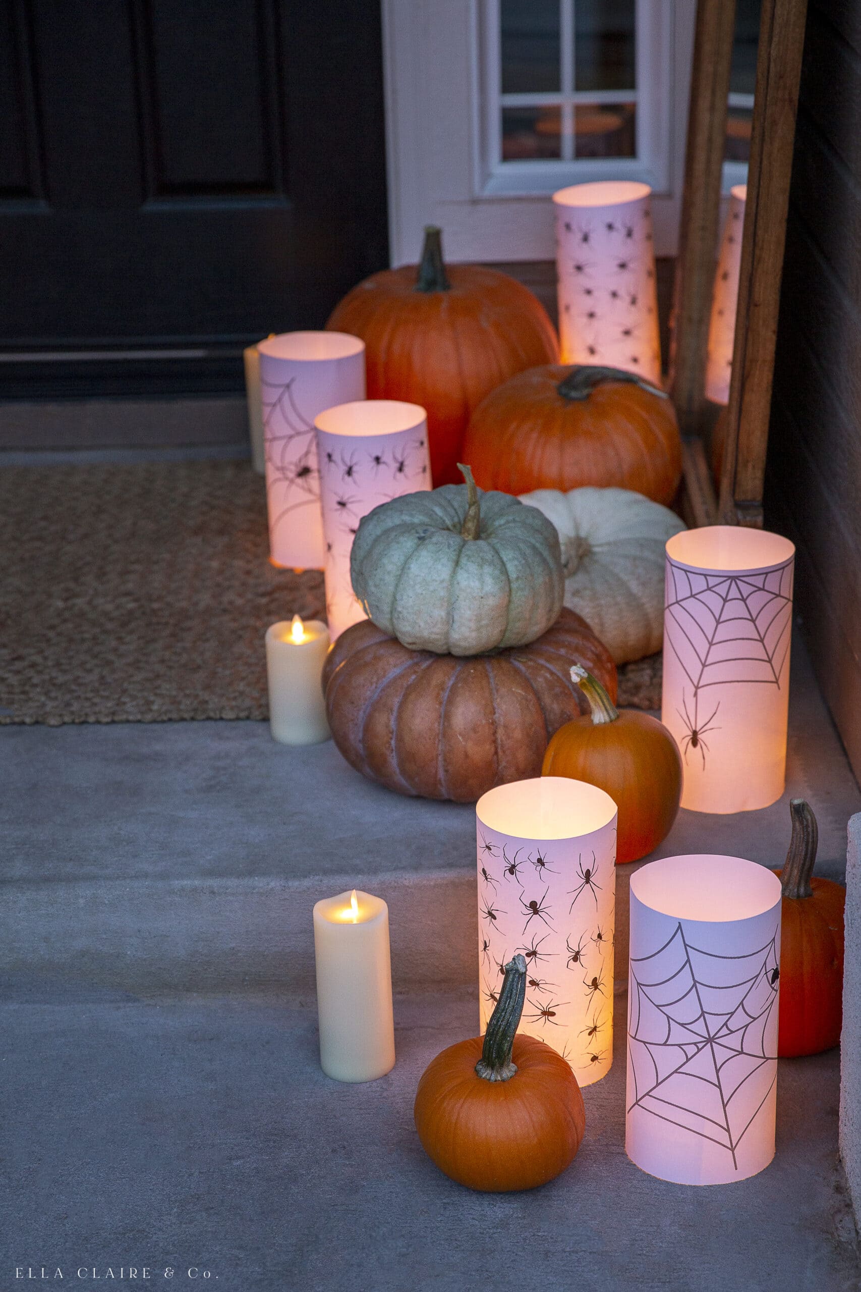 stacked pumpkins with candle luminaries