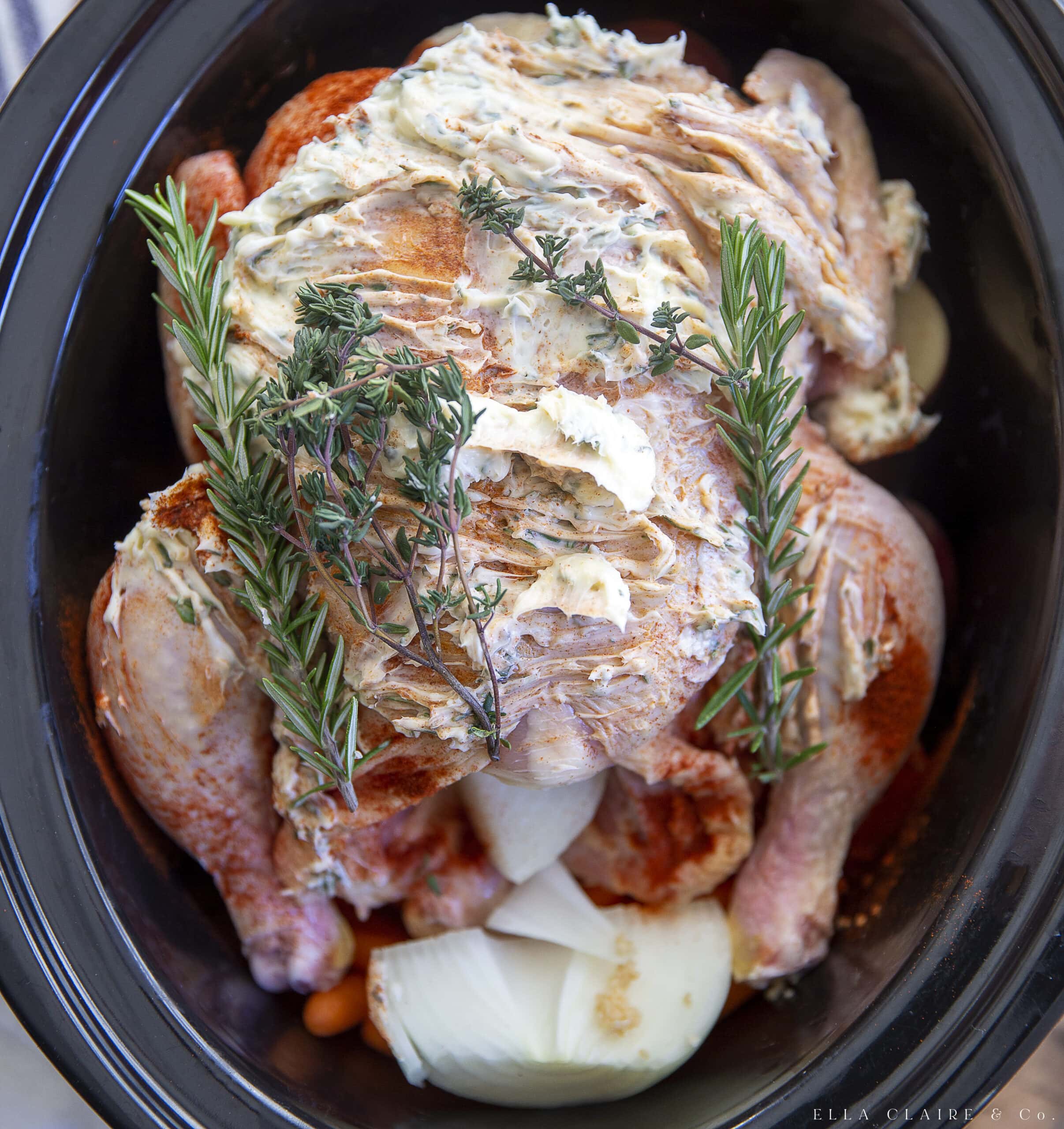 spread herb butter on top of whole chicken