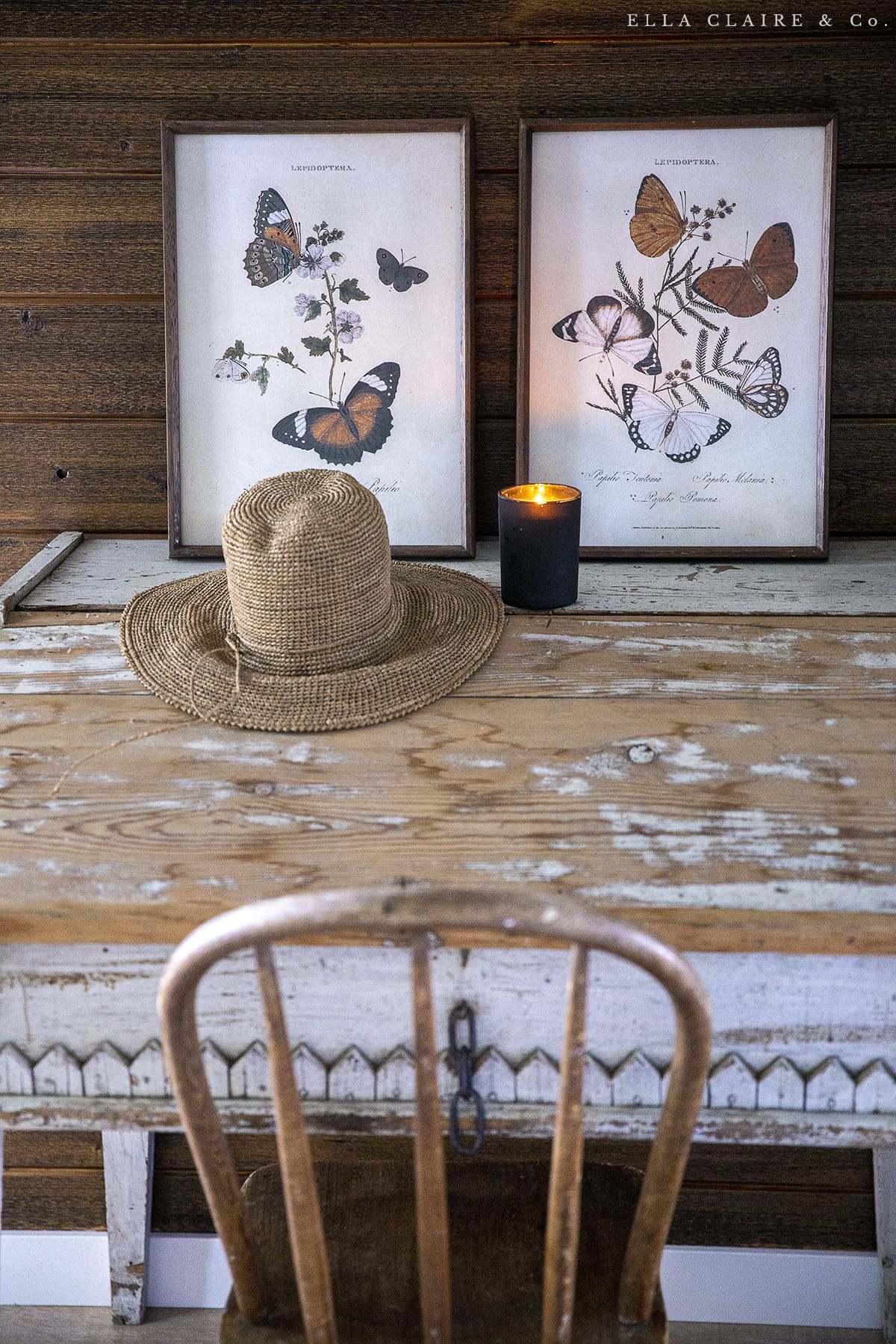 vintage desk with candle and artwork