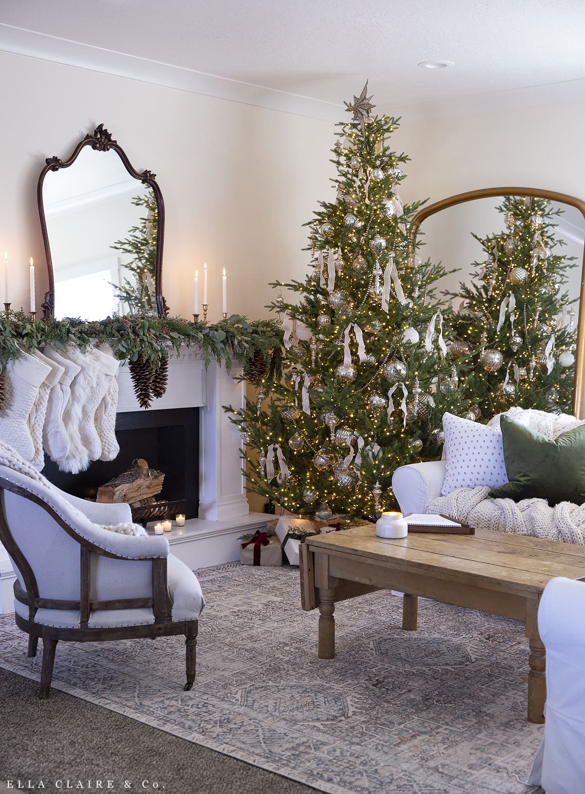 Family room decorated for Christmas with tree and fireplace