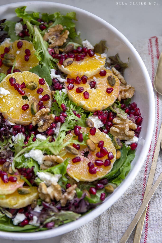oranges, pomegranates, nuts, and feta on Christmas Salad