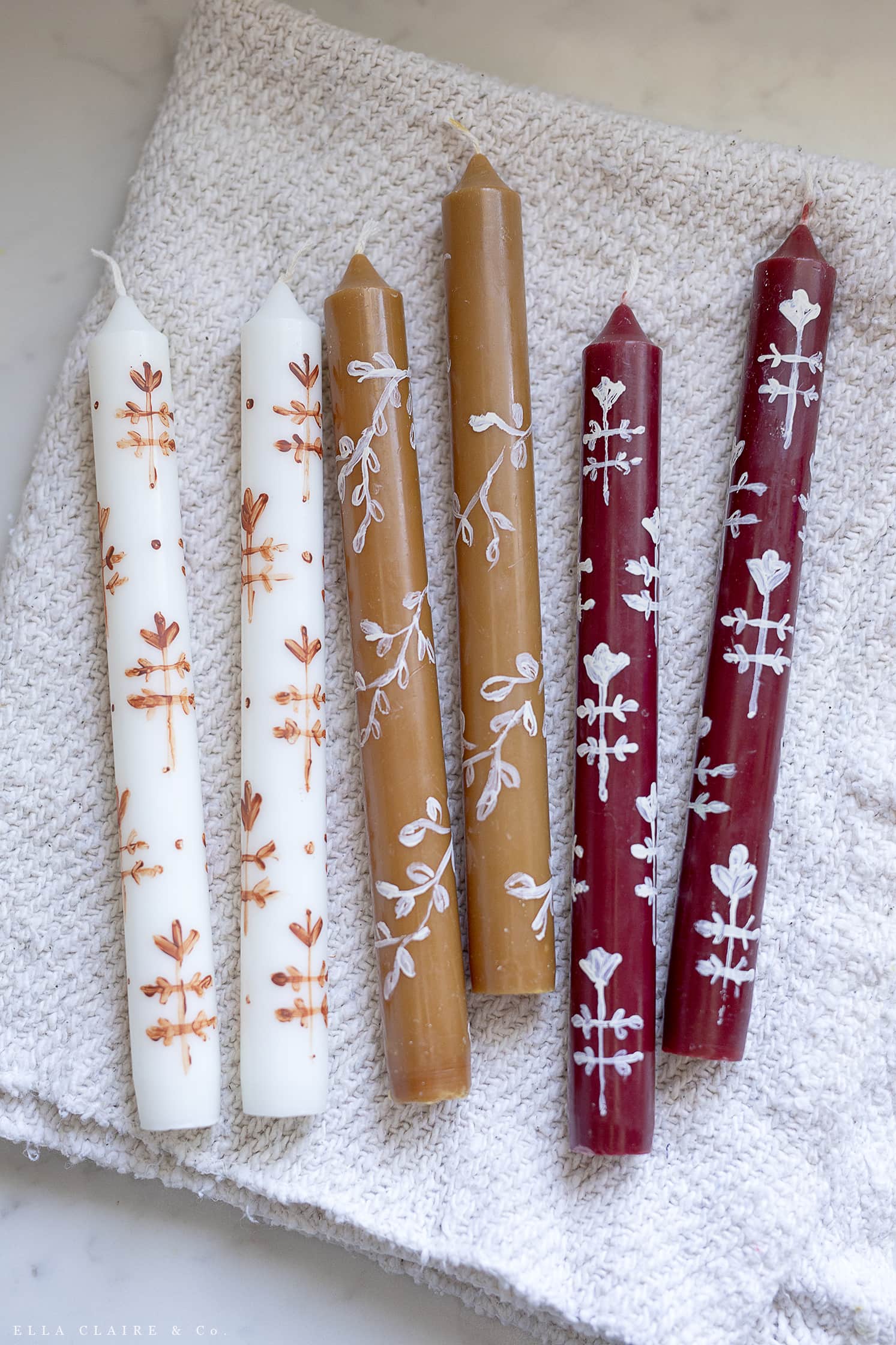 block print and leaves on painted candles